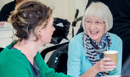 researcher and older person talking
